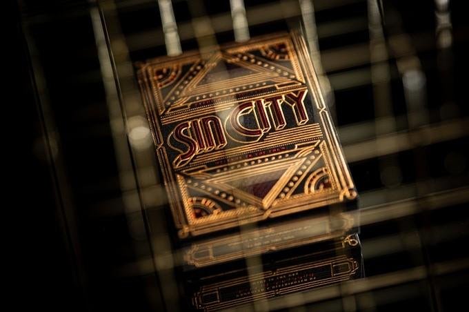 Sin City Playing Cards, by Alba Zapata x Riffle Shuffle. Art deco, Las Vegas,  casino, decadence, sultry jazz, hot-stamped gold, red foil, roulette.  Sealed with cellophane, limited edition of 2500 – Vedic